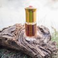 Arabian oud attar perfume or agarwood oil fragrances in mini bottle.